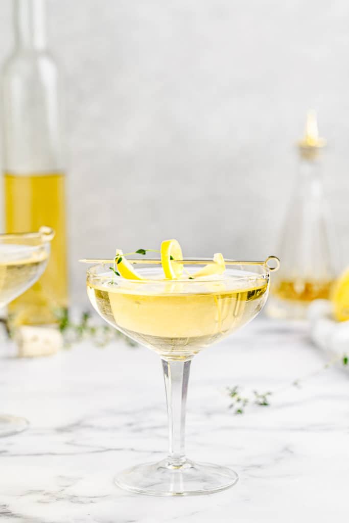 limoncello thyme spritzer in a coupe glass