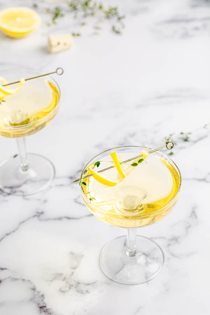 limoncello thyme spritzer in a coupe glass