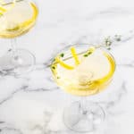 glasses of limoncello thyme spritzer on marble