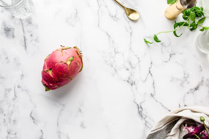 overhead shot of dragonfruit on marble countertop