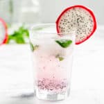 finished dragonfruit mojito cocktail close up in a highball glass
