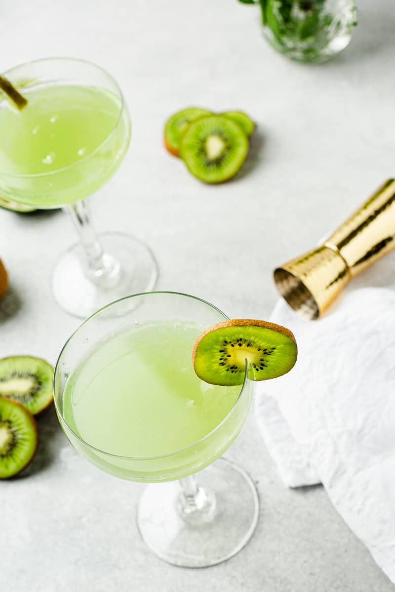 green cocktails in coupe glasses