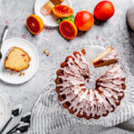 overhead view of table arrangement with blood orange pound cake and cake slices on plates