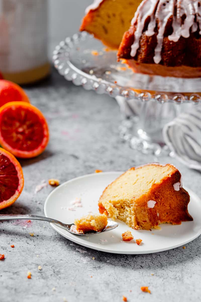 slice of blood orange pound cake with a bite taken out of it
