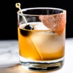 close up of mezcal cocktail with cocoa sugar on half of the rim