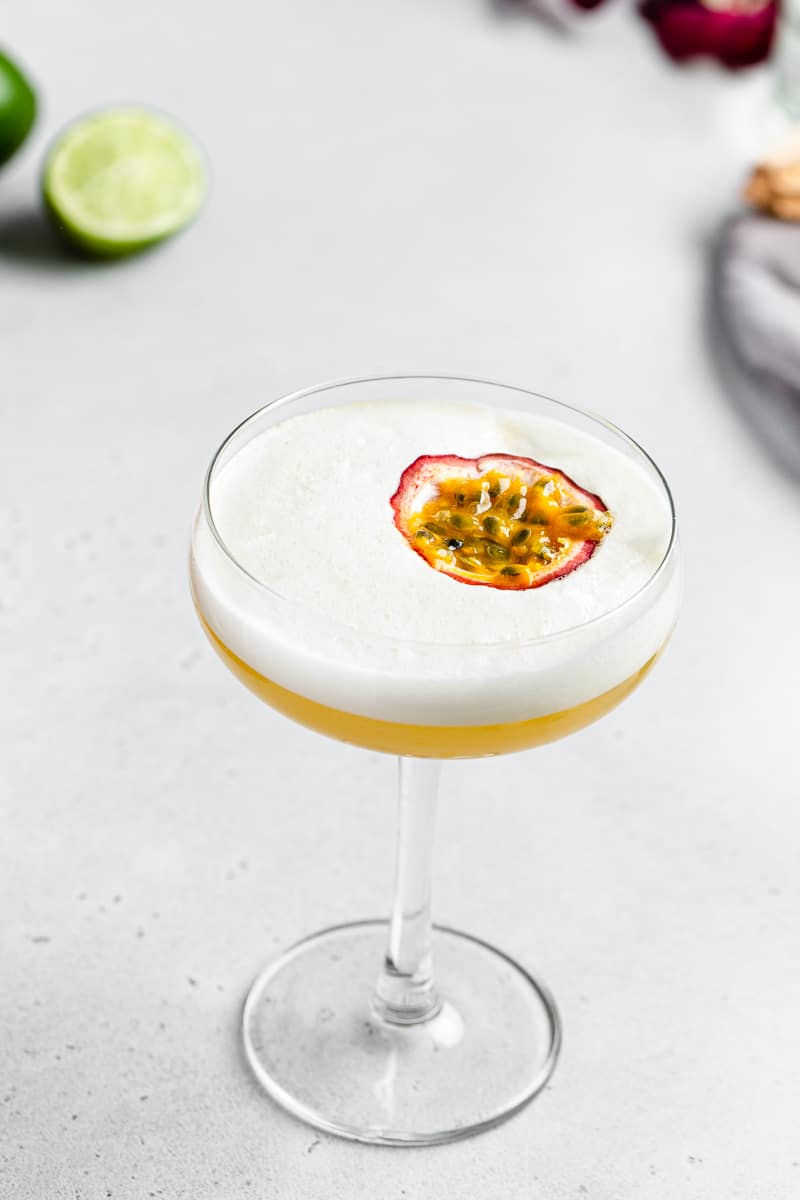 overhead view of passionfruit mango sour cocktail