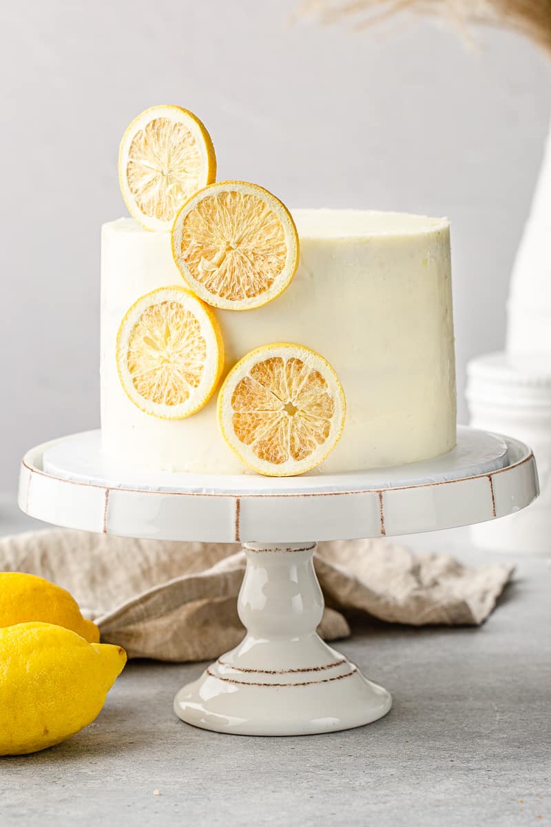 front view of the lemon layer cake on a cake stand