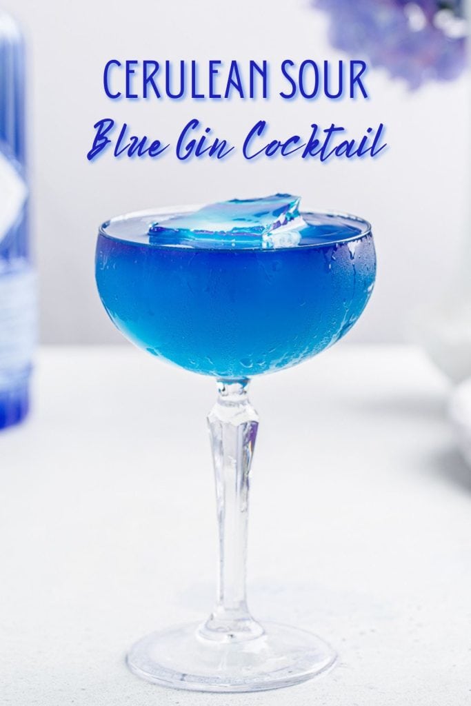 Side view of a blue cocktail in a coupe glass. Text at the top says "Cerulean sour blue gin cocktail".