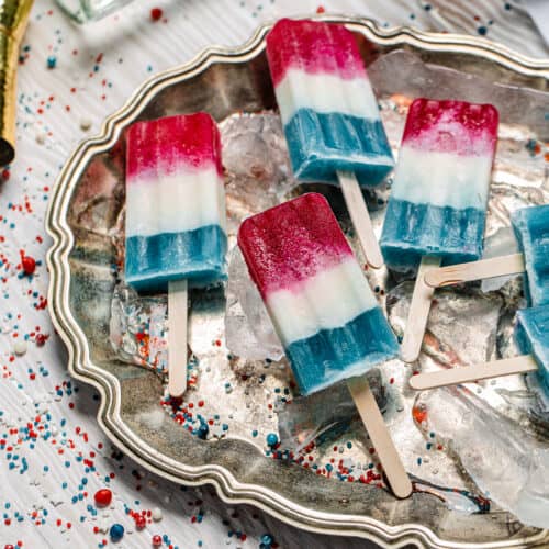 red, white and blue popsicles on a platter