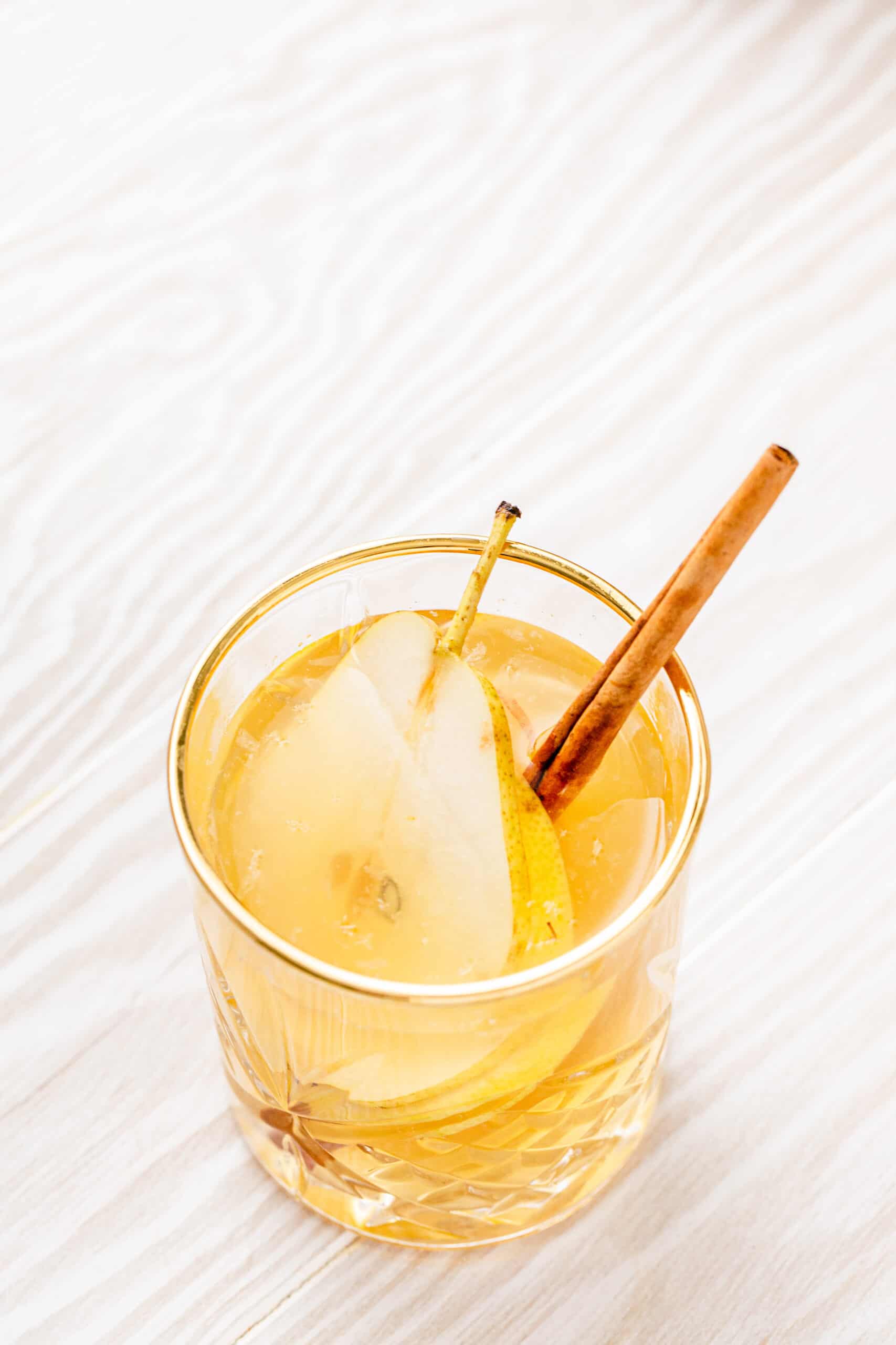 top view of fall sangria with pear in the glass