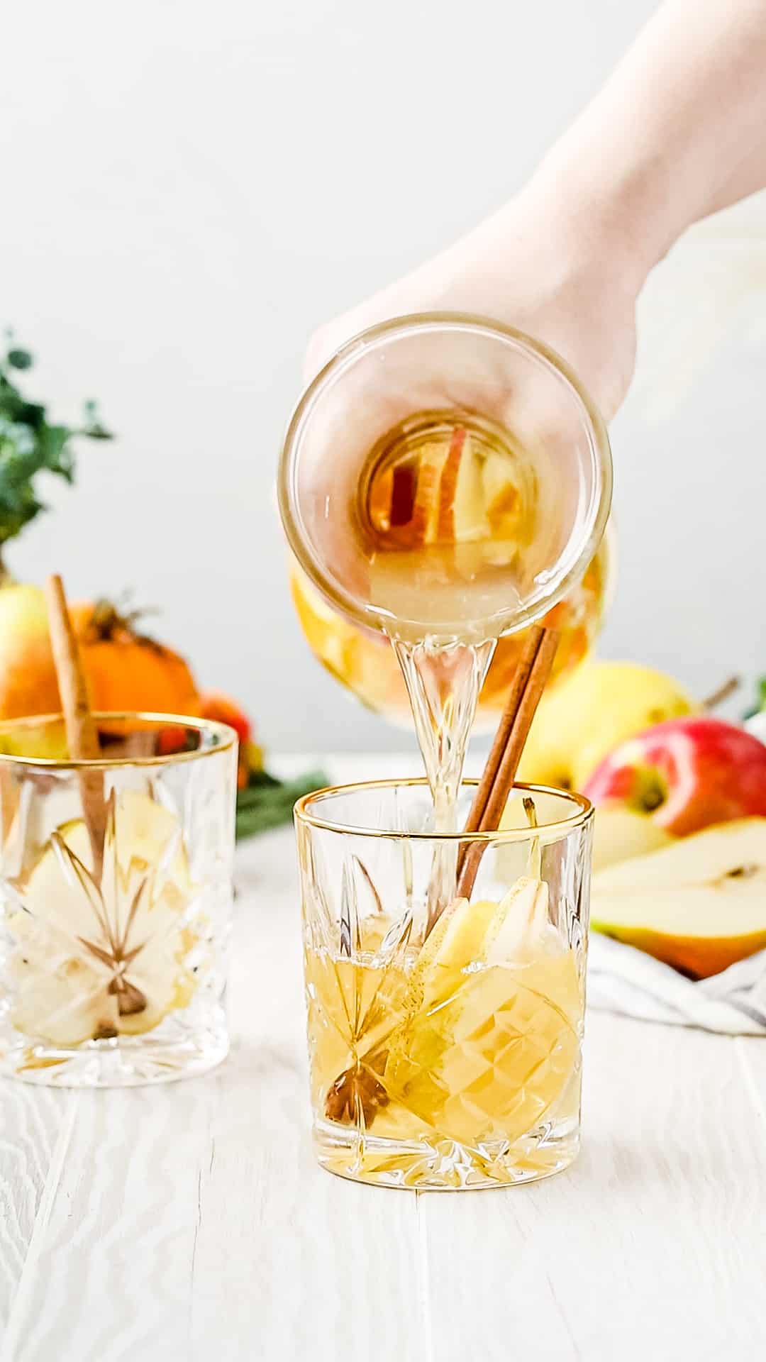 pouring the sangria into the serving glass