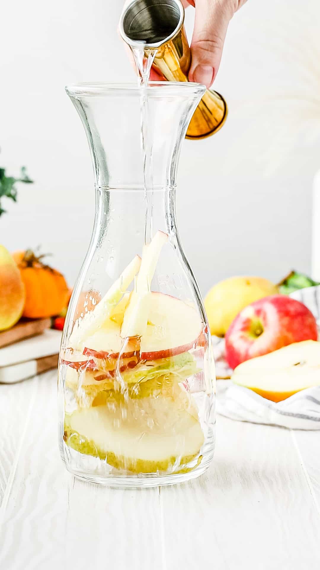 pouring in the pear flavored vodka