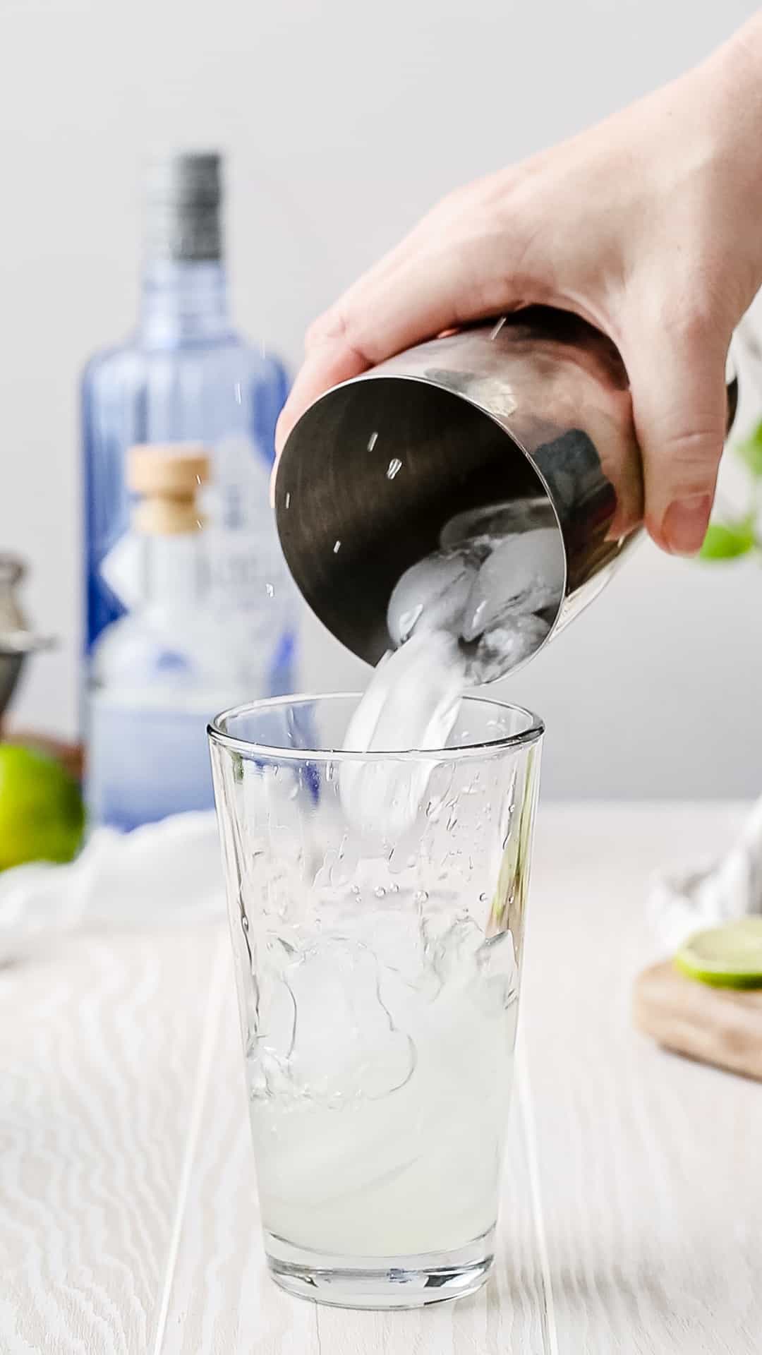 adding ice to the shaker