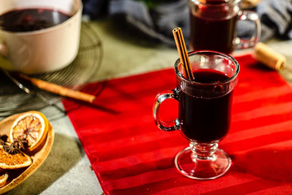 top view of mulled wine in a mug with a cinnamon stick