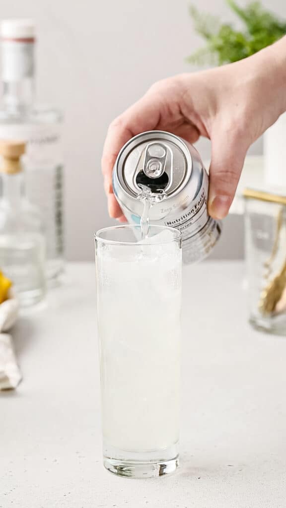 topping the drink with seltzer