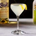 Side view of the Corpse Reviver No 2 cocktail with Lillet Blanc and an absinthe atomizer in the background.