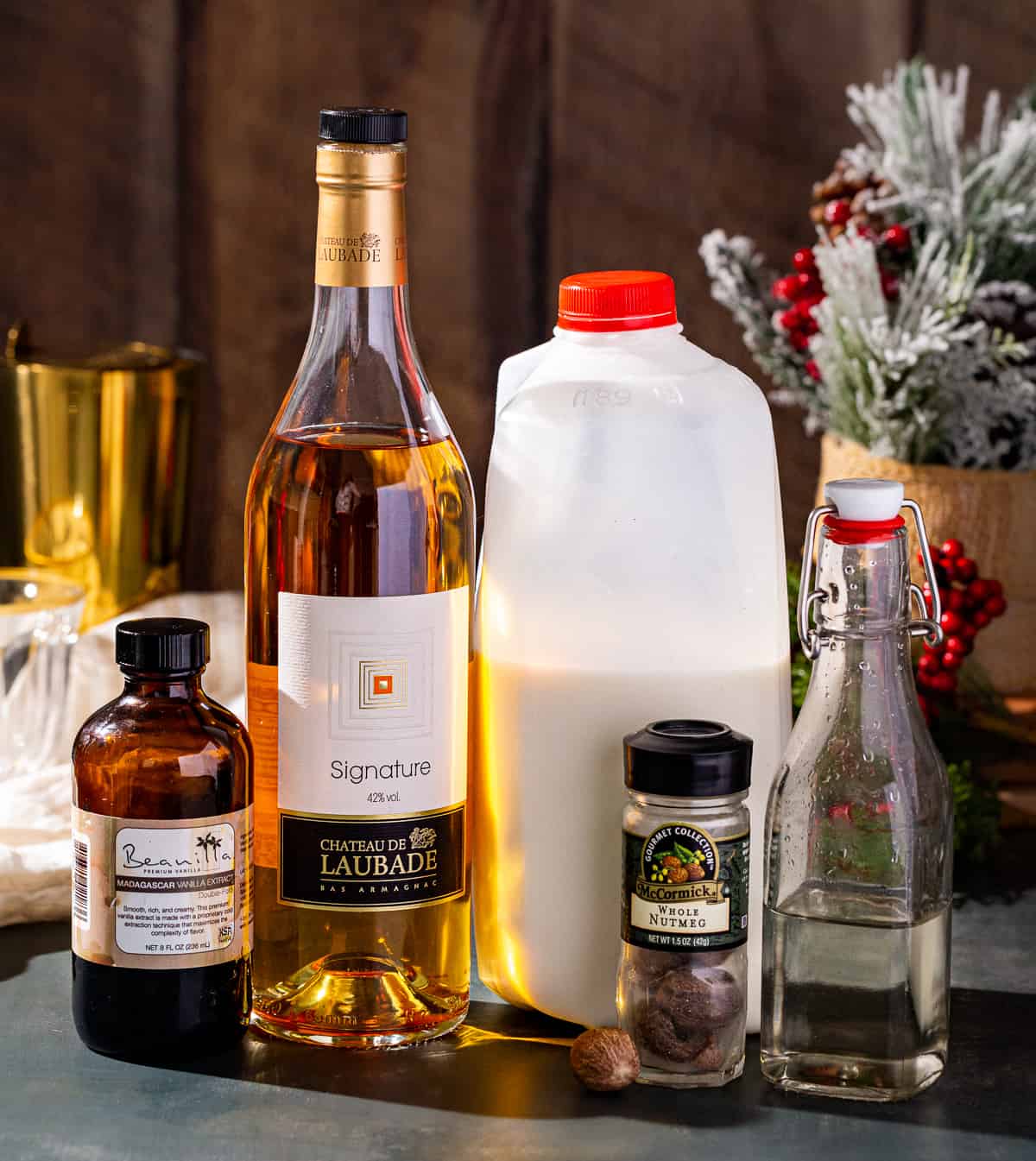Ingredients to make a Brandy Milk Punch together on a countertop.