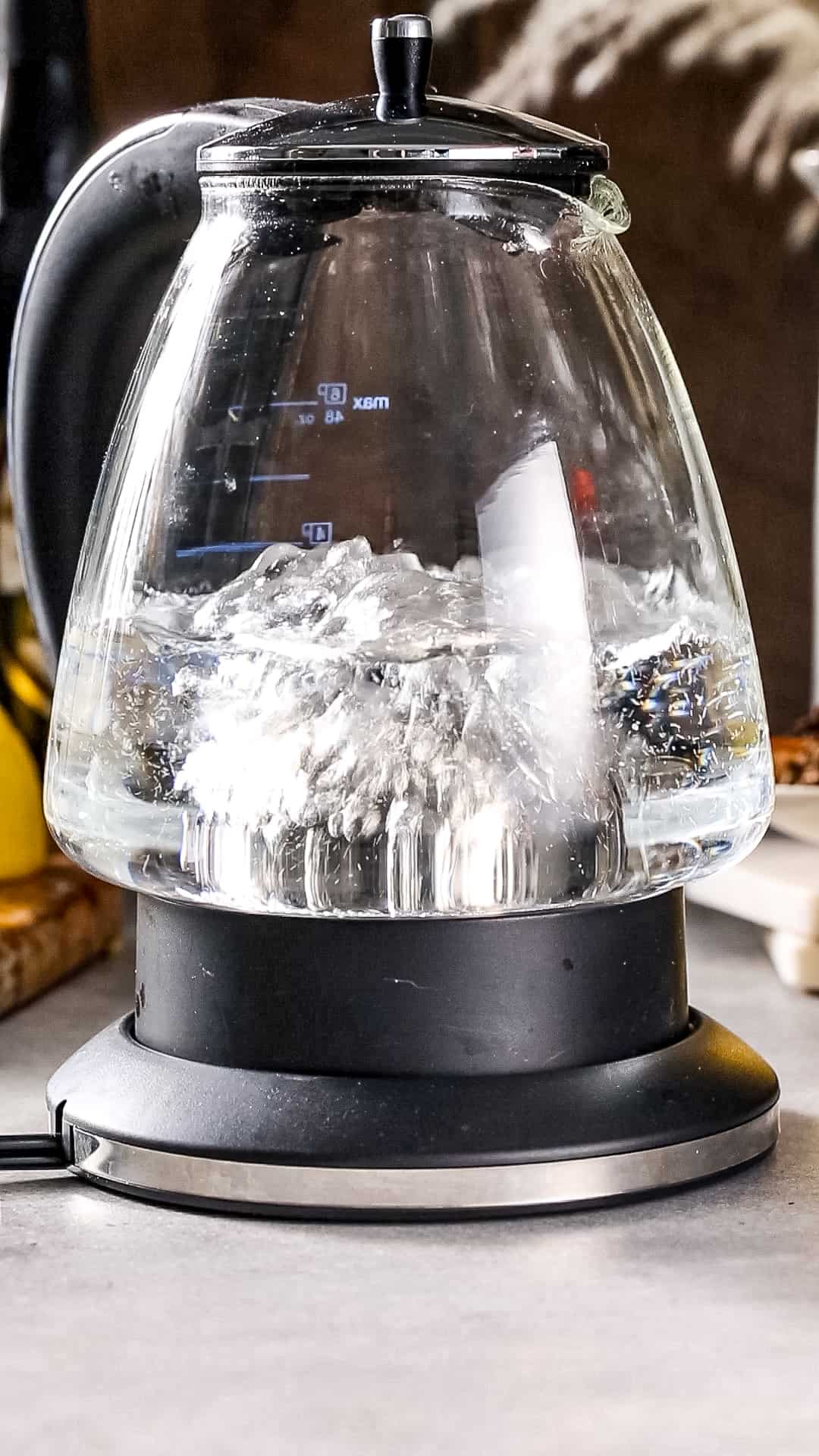Water boiling in a glass electric kettle.