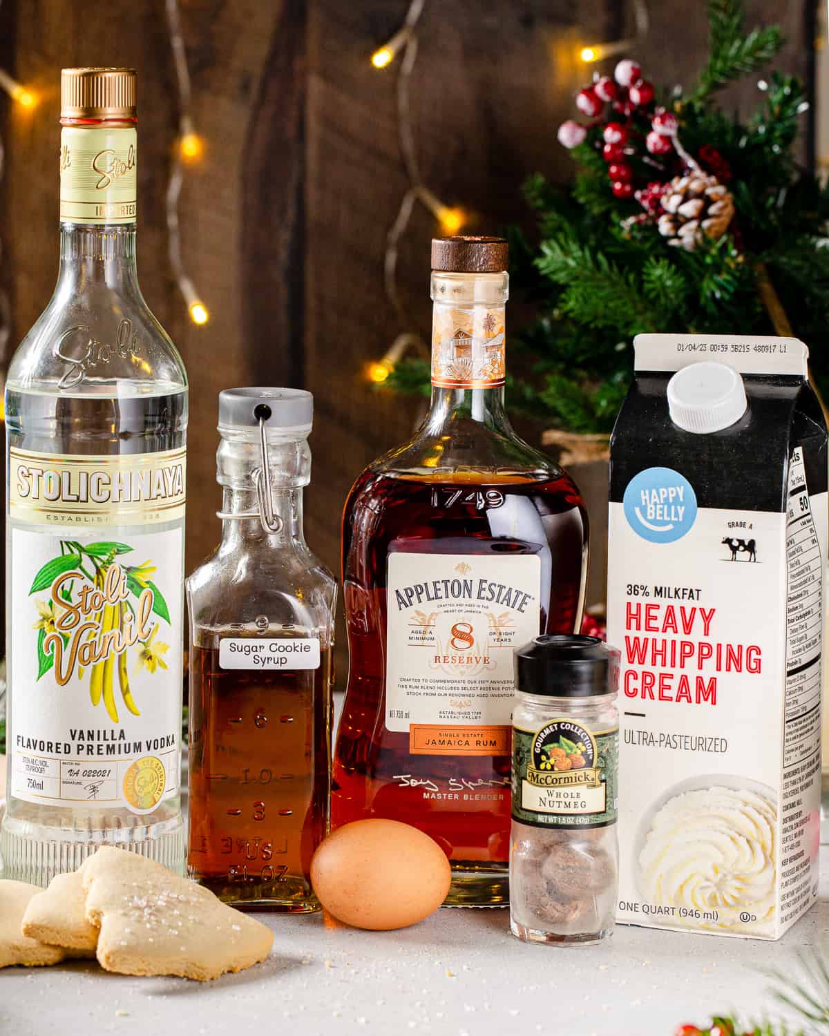 Ingredients to make Sugar Cookie Eggnog together on a countertop.