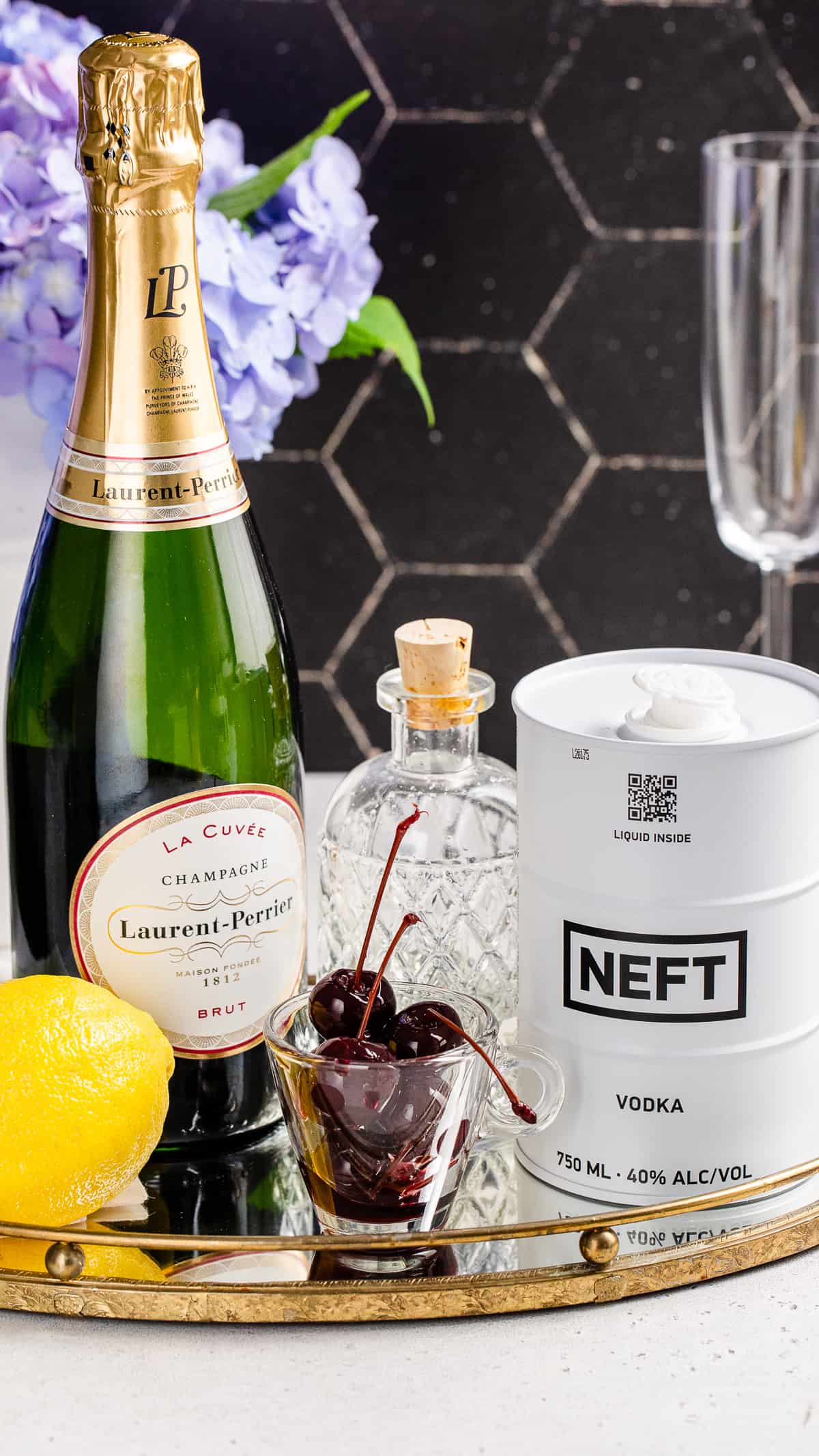 French 76 ingredients together on a countertop.