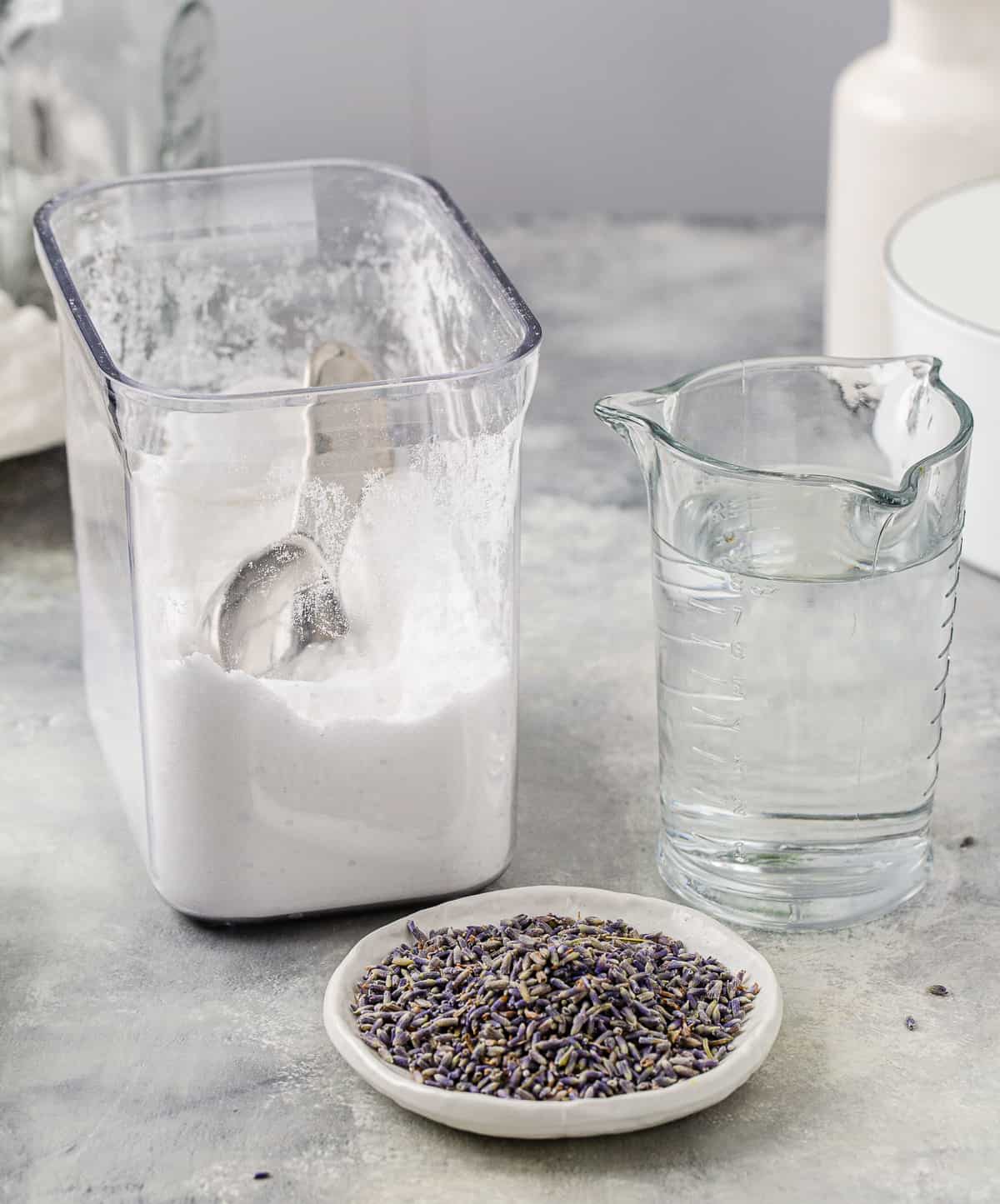 Ingredients to make Lavender Syrup together on a countertop.