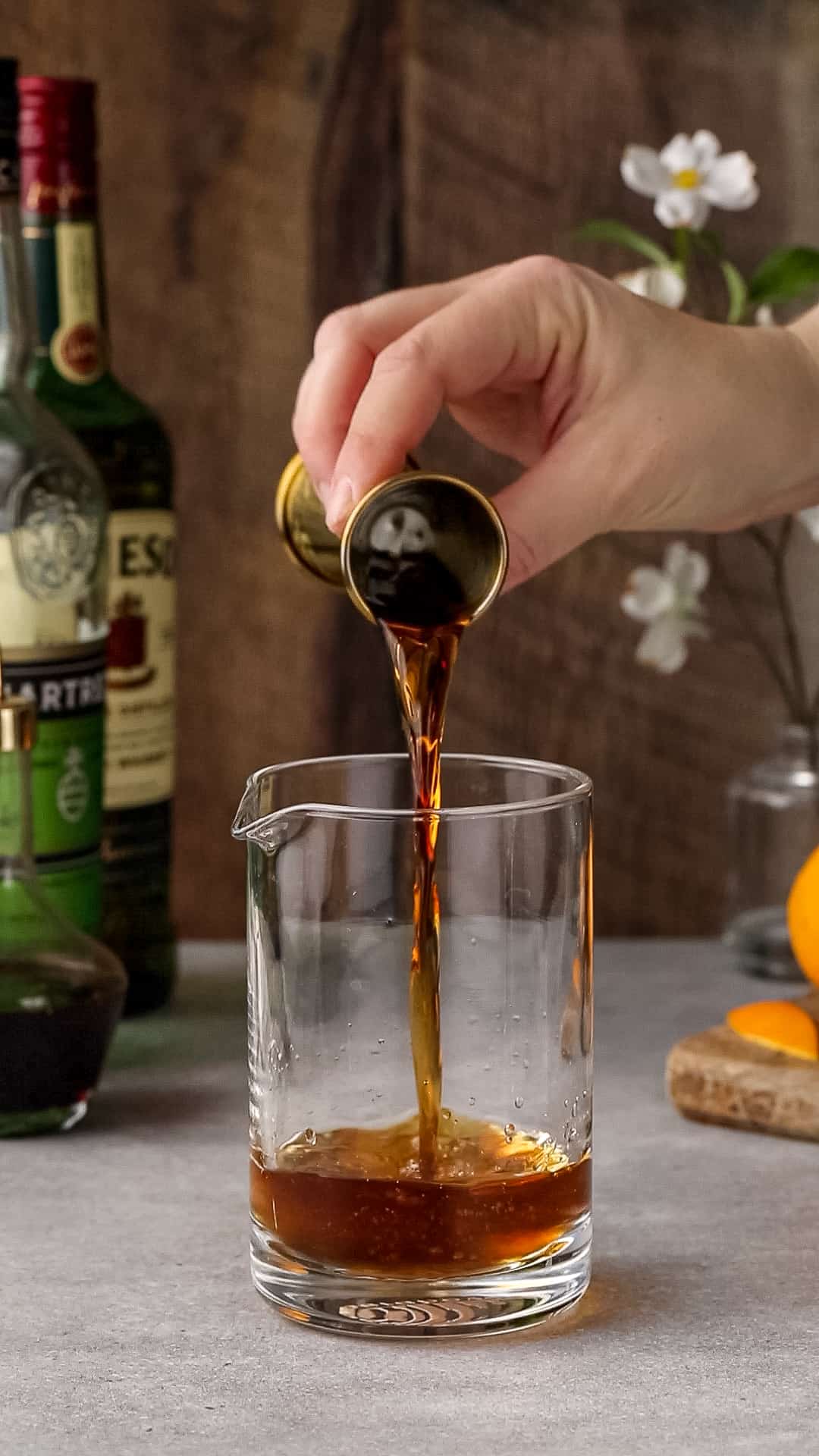 Vermouth is added to the mixing glass.