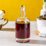 A capped bottle of homemade earl grey syrup.