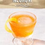 Slight overhead view of Aperol Negroni cocktail in a vintage style cocktail glass. The drink is orange colored and has a yellow lemon peel garnish. Text at the top says “aperol negroni” and at the bottom says “gin cocktail with aperol and vermouth”.