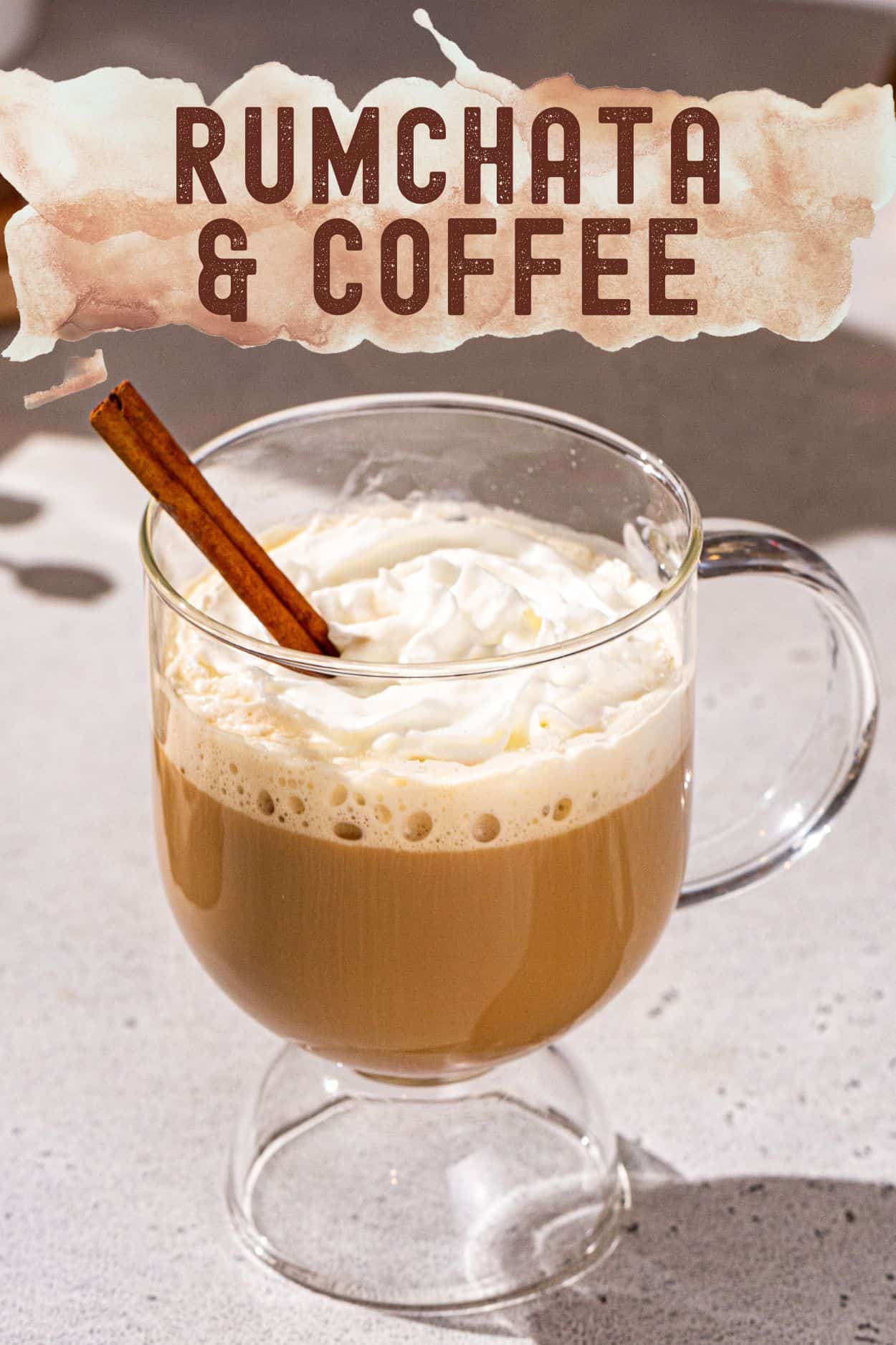 Text at the top says "Rumchata & Coffee", and below the text is an image of the Rumchata Coffee cocktail. The drink is in a glass mug with a handle and looks like a latte, with a layer of whipped cream on top and a cinnamon stick for garnish.
