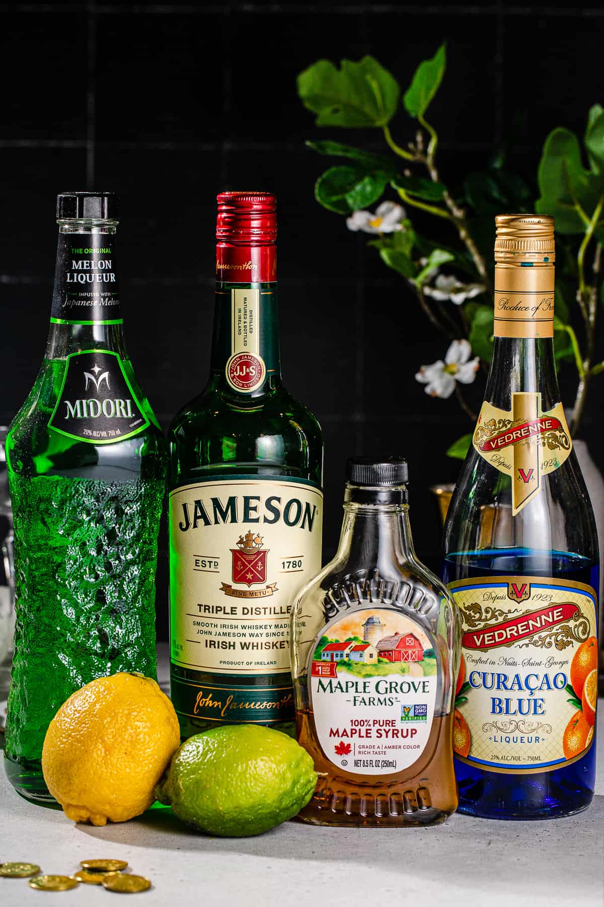 Ingredients to make a Shamrock Sour together on a countertop.