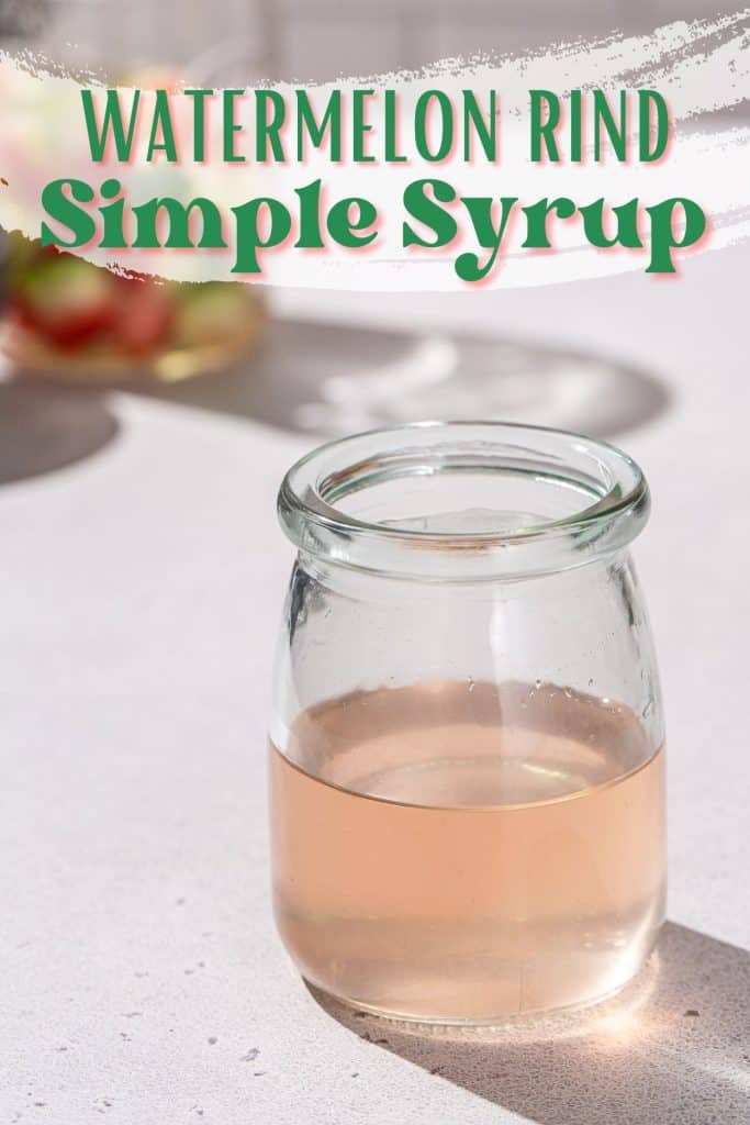 Watermelon rind syrup in a jar on a countertop. Text overlay at the top of the image says “Watermelon Rind Simple Syrup”.