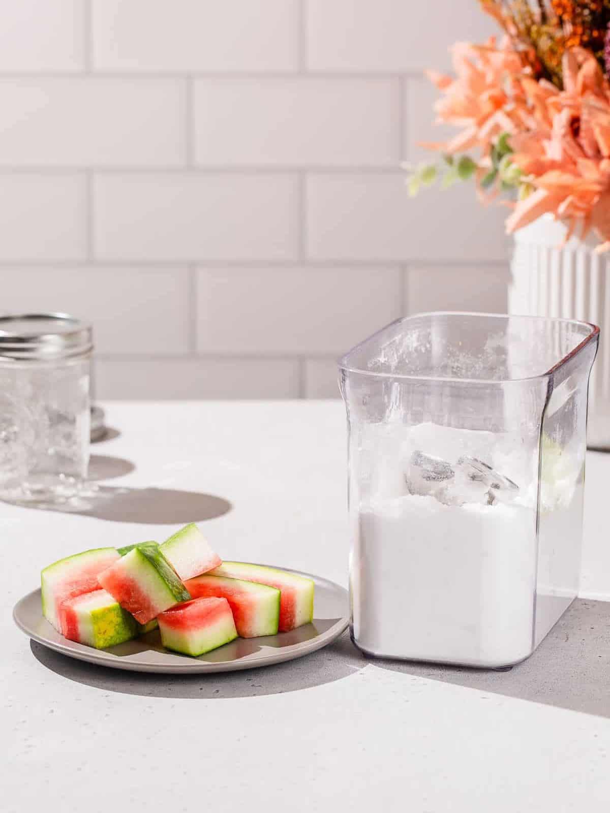 Ingredients to make Watermelon Rind syrup together on a countertop.