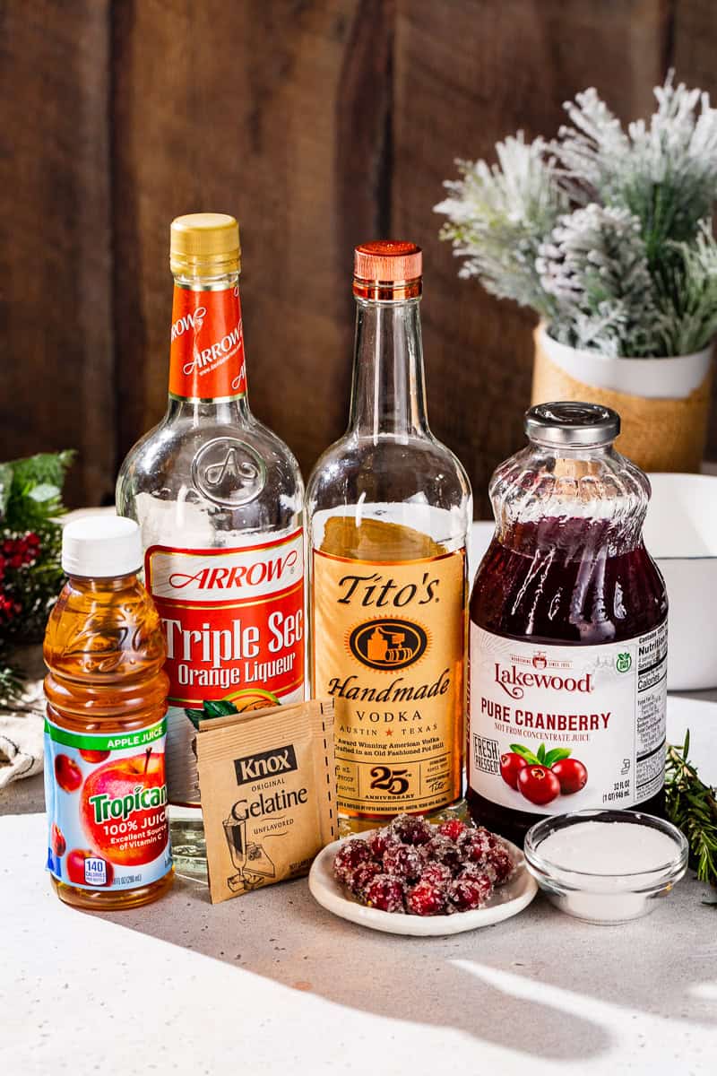 Ingredients to make Cranberry Christmas Jello Shots together on a countertop.