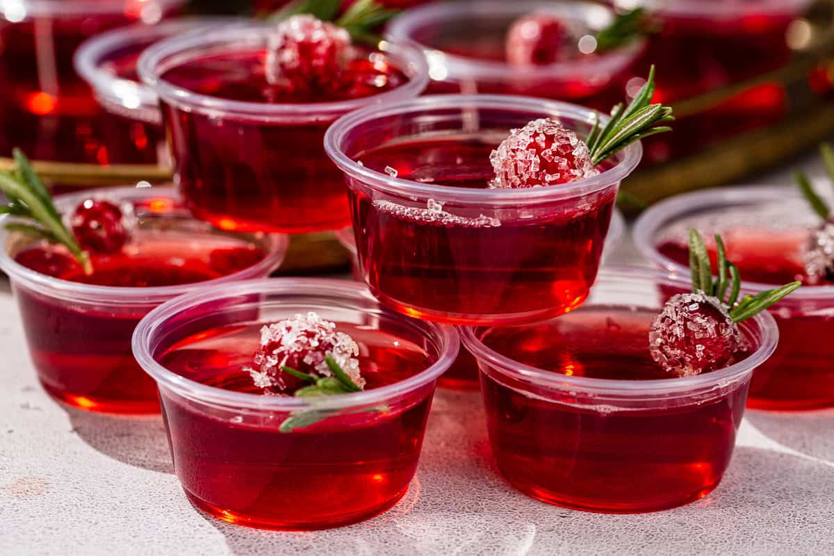 Side view of a stack of Cranberry Christmas Jello Shots.