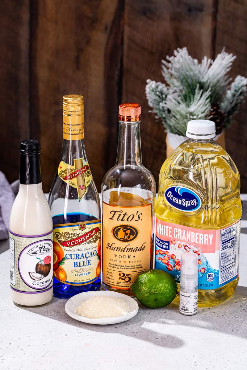 Ingredients to make a Jack Frost cocktail together on a countertop.